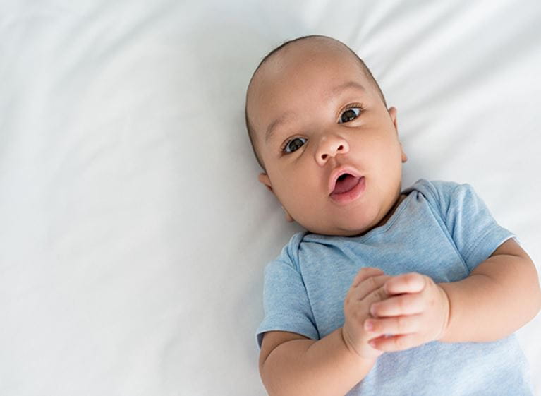 Baby laying in bed