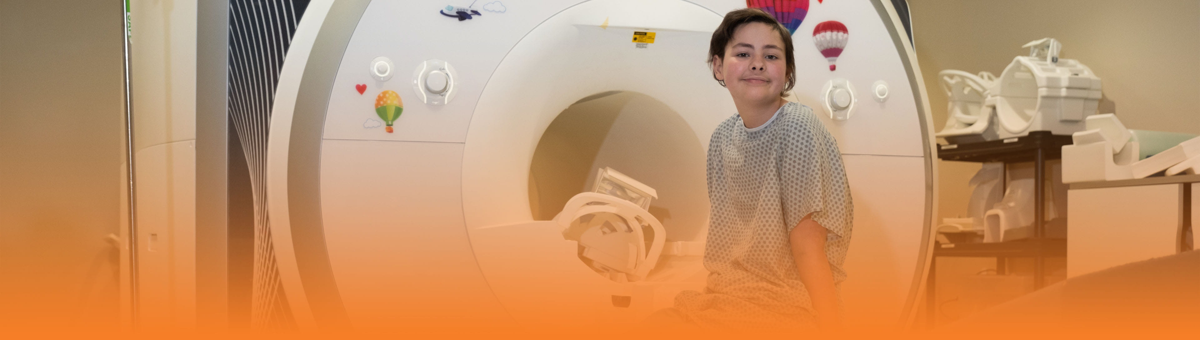 Teenage girl with short brown hair ready for an MRI.