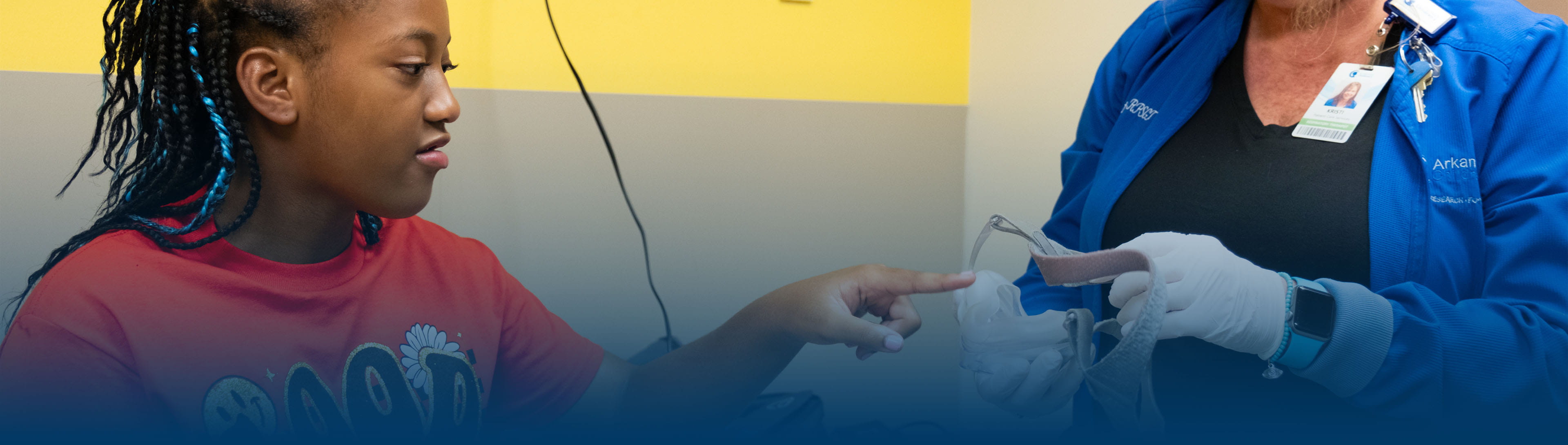 Patient trying on cpap in clinic.