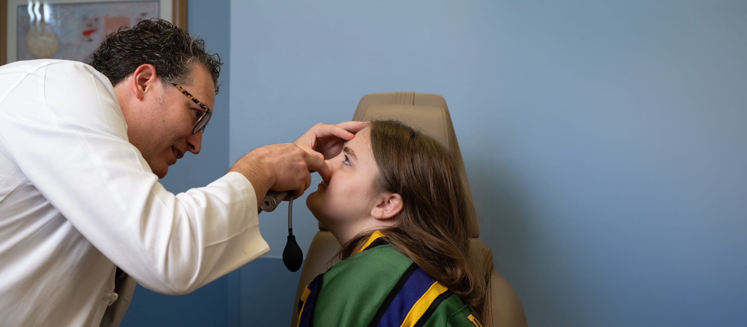 Dr. Hartzell performs nasal exam on cleft patient.