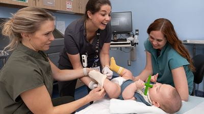 Infant boy being treated by orthopedic team.