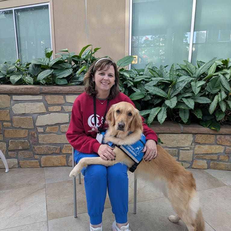 Pet therapy dog, Snickers with handler, Amy Palmer.