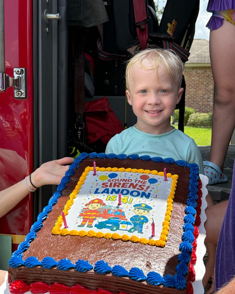 Landon Sawyer smiling with birthday cake.