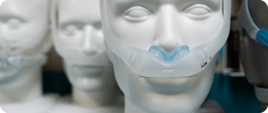 Dummy heads wearing cpaps.