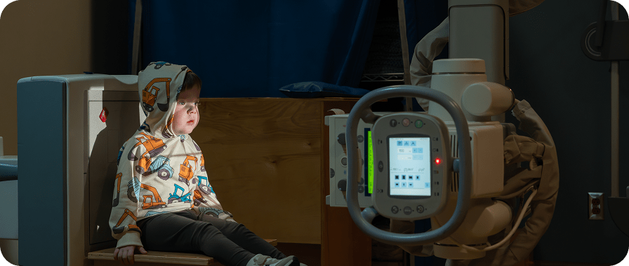 Toddler boy getting chest x-ray.